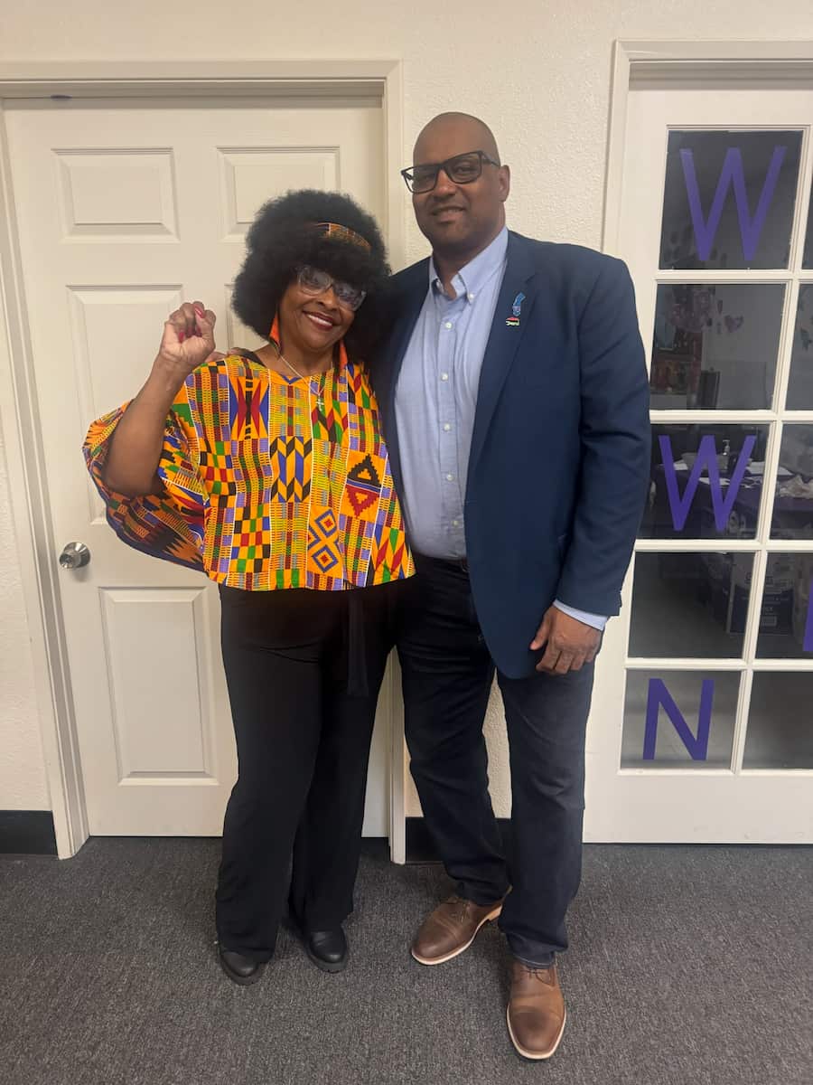 Cedric with community supporter at gathering