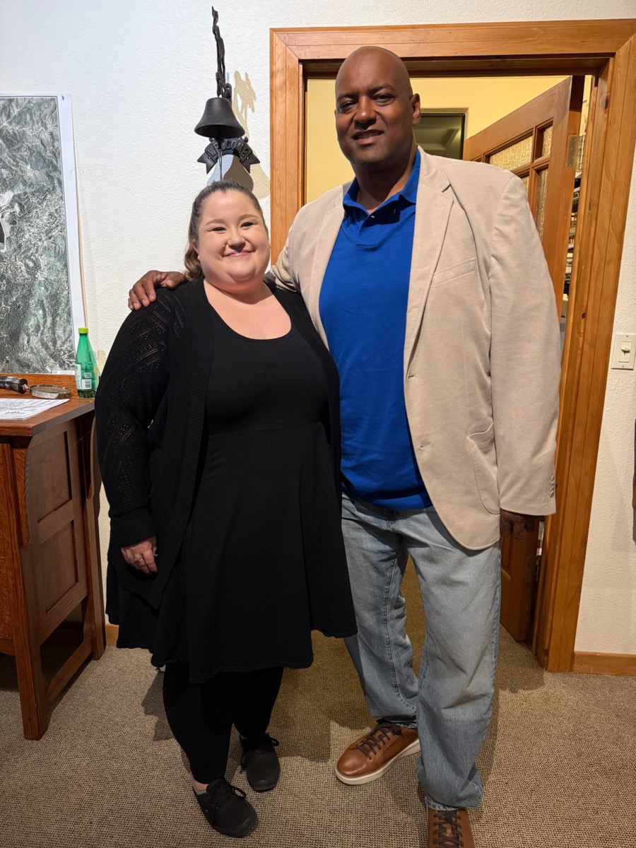 Cedric visiting with supporter